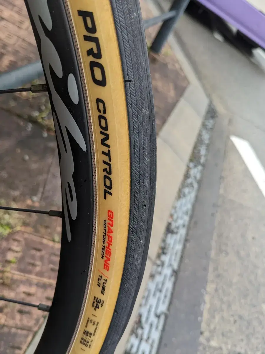A close view of a bicycle tyre after roadside repairs