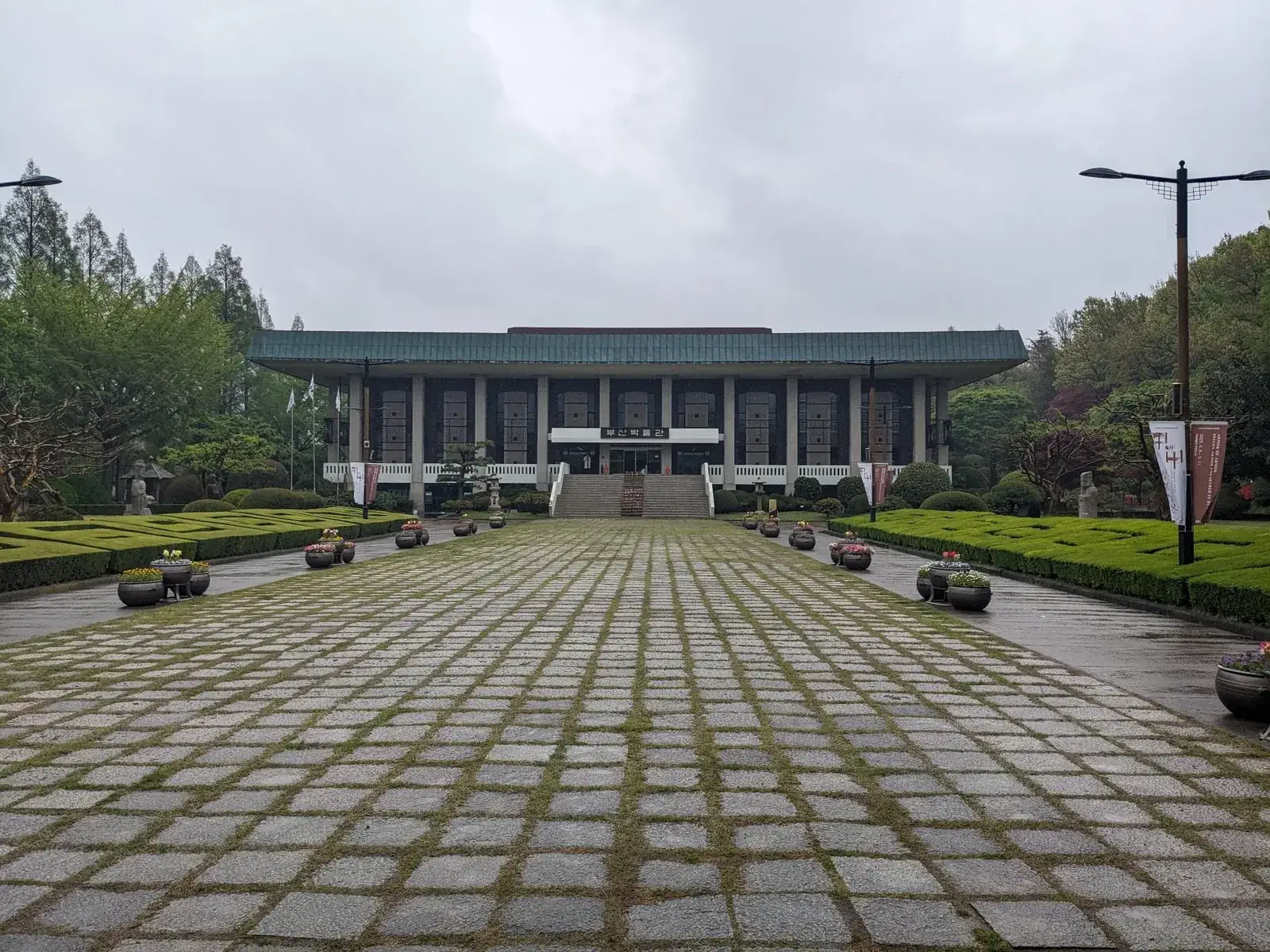 A modern museum beyond a broad stone plaza