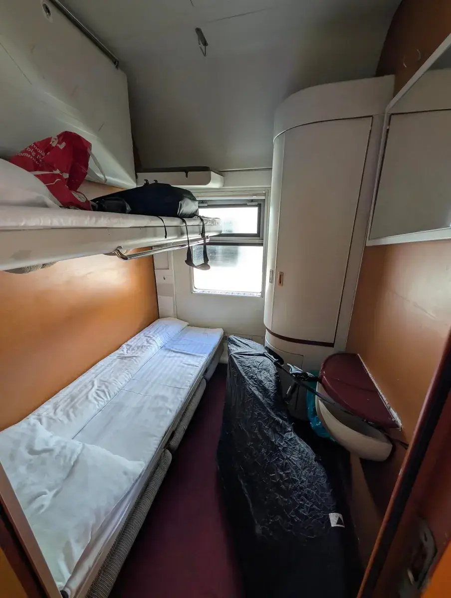 A compact sleeper compartment on a night train