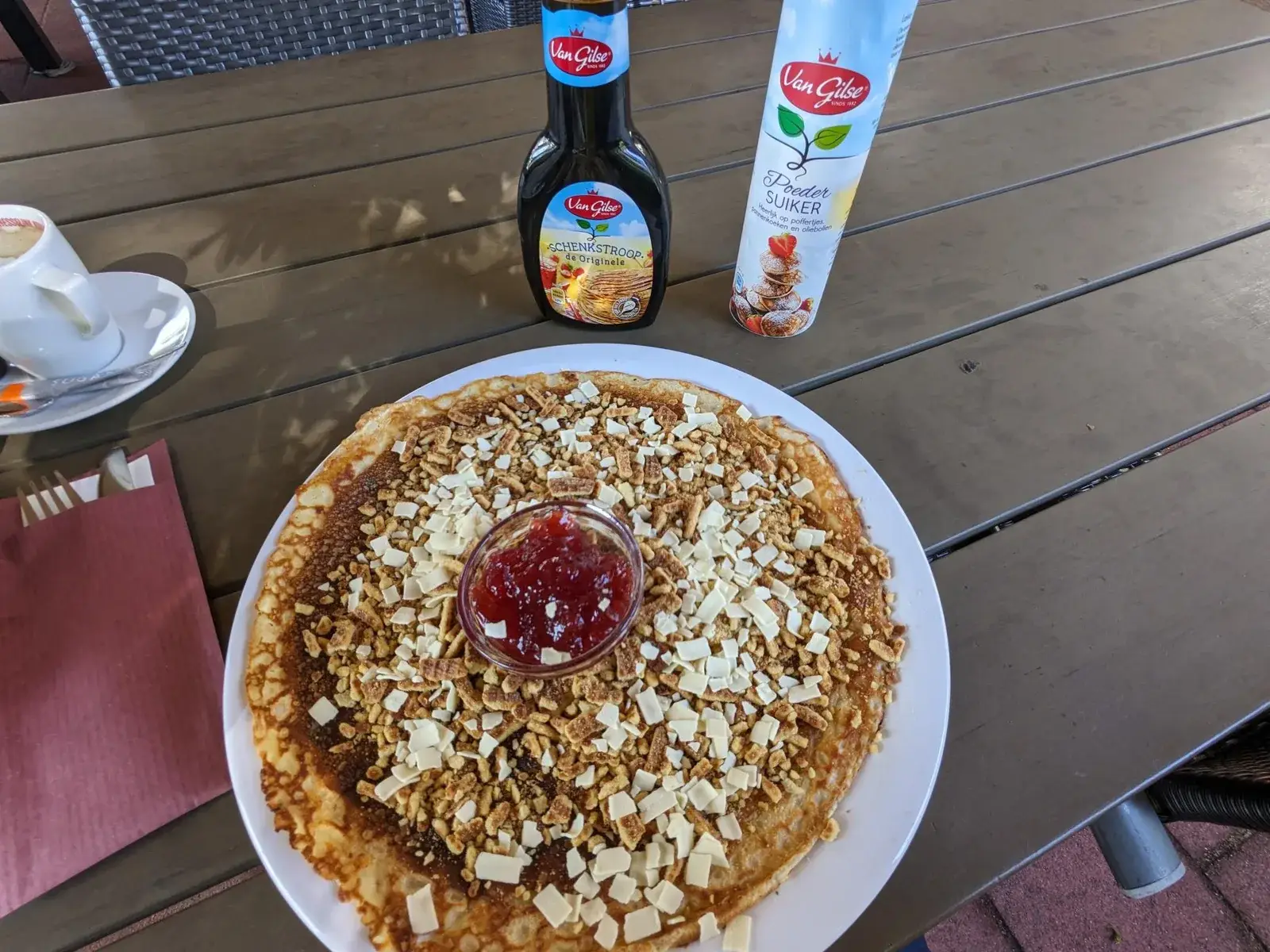 A large almond pancake served outdoors