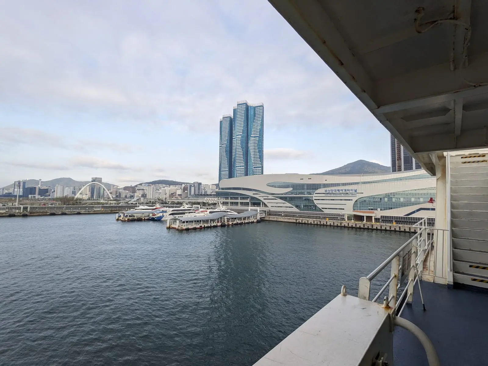 A view of Busan's waterfront towers and ferry terminal from the harbour