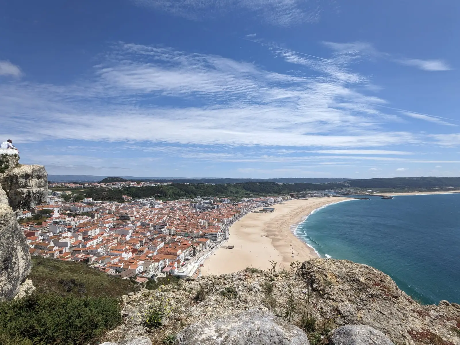 Nazaré and its long sandy beach seen from a clifftop
