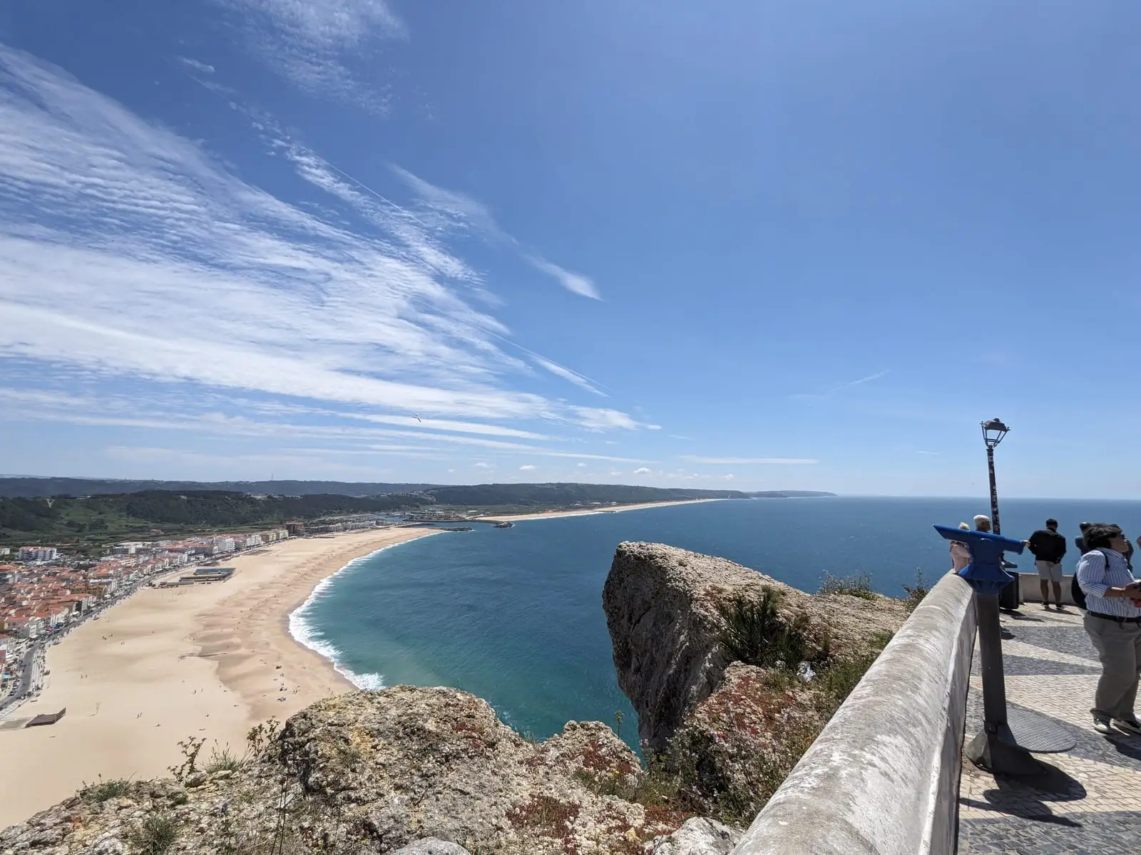 The curving Nazaré coastline seen from a clifftop viewpoint