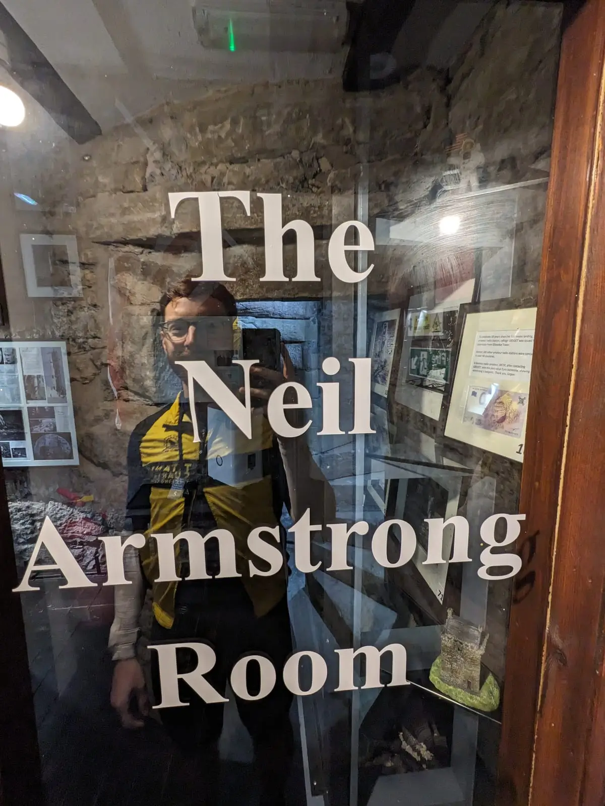 The words The Neil Armstrong Room on a glass door inside Gilnockie Tower
