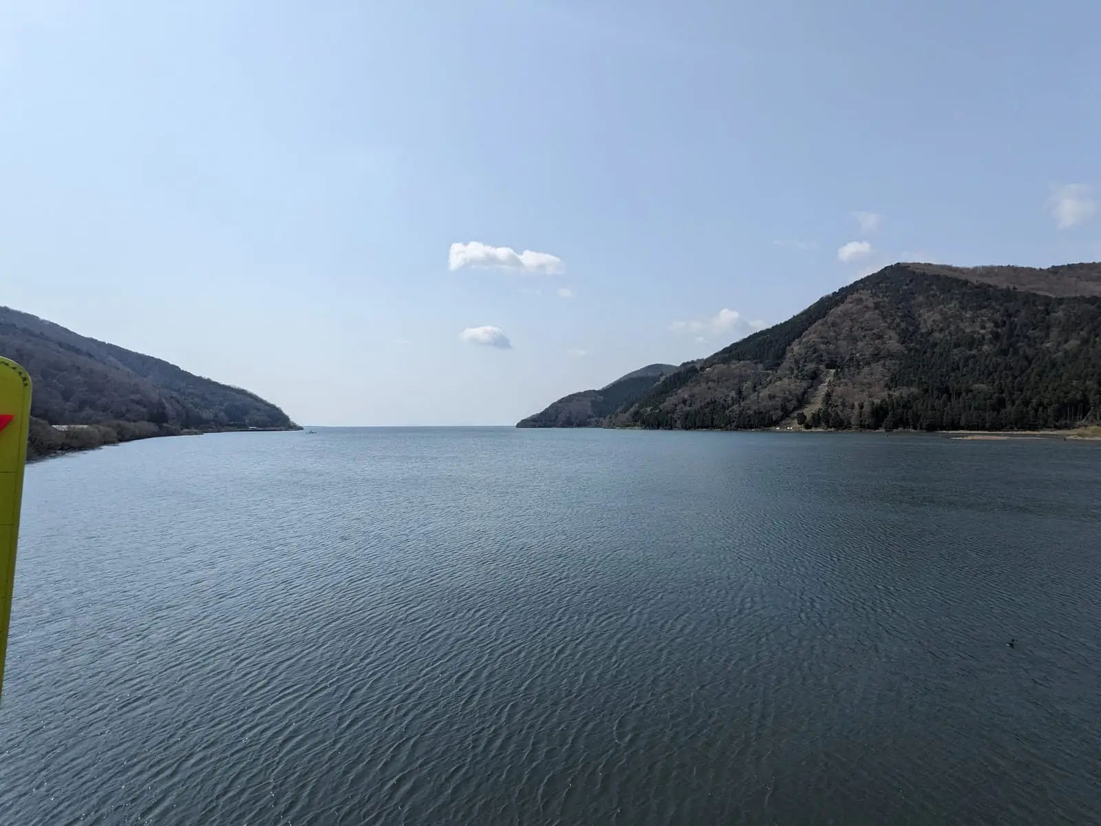 A wide, calm view across Lake Biwa toward hills on the far shore