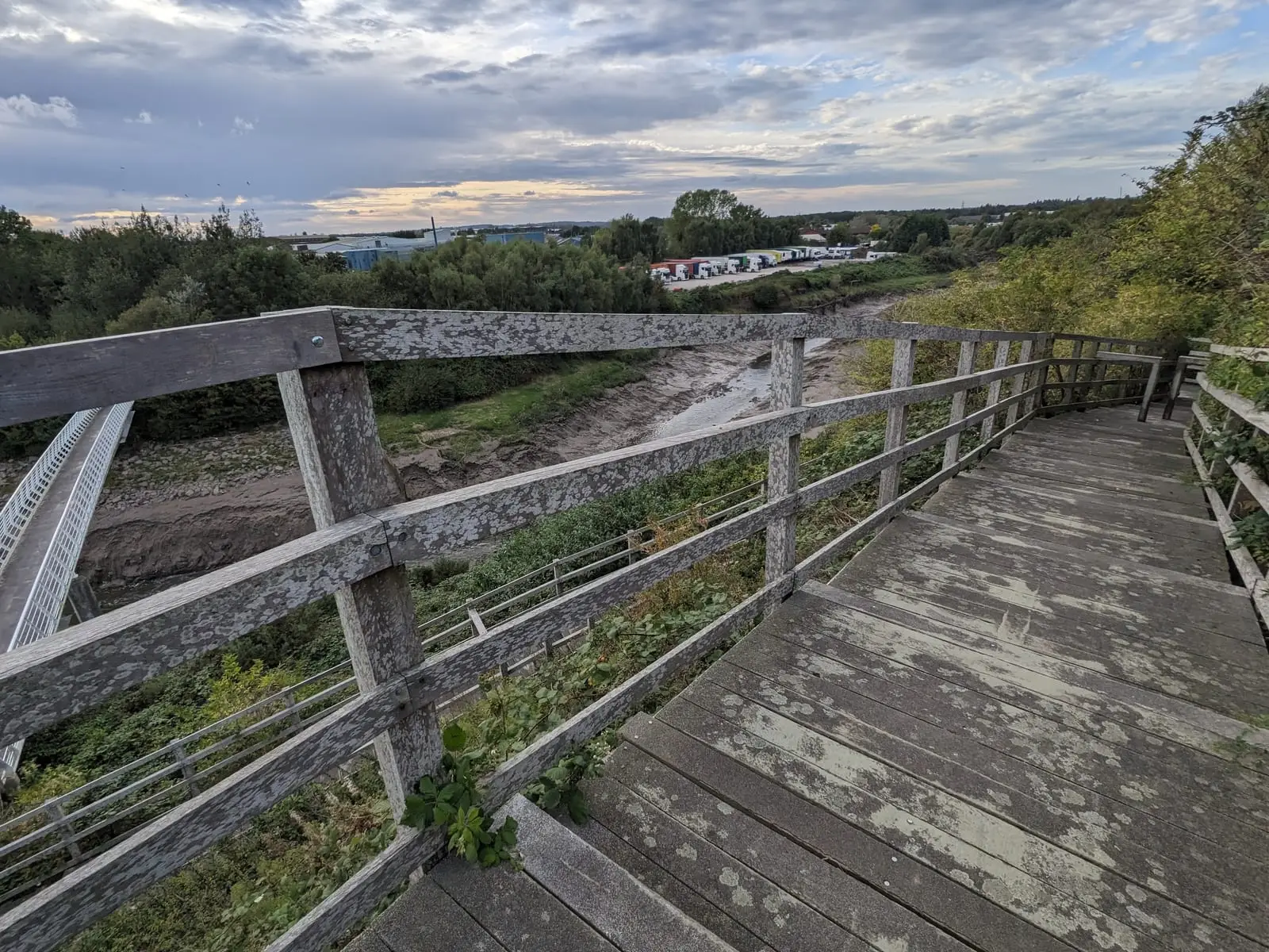 A wooden staircase descending beside the route towards Liverpool